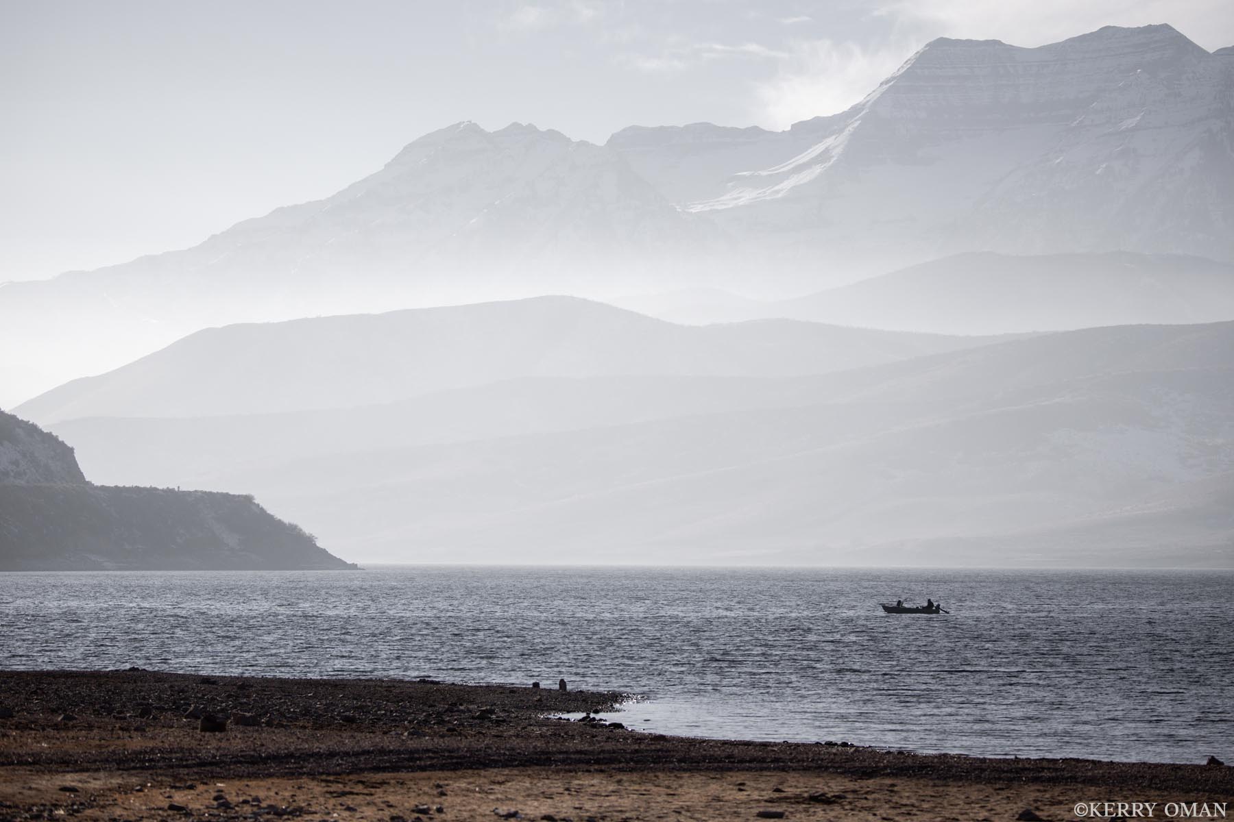Midwinter Drift A small fishing boat glides across Deer Creek Reservoir beneath the winter shadows of Mount Timpanogos. The cold air hangs in...
