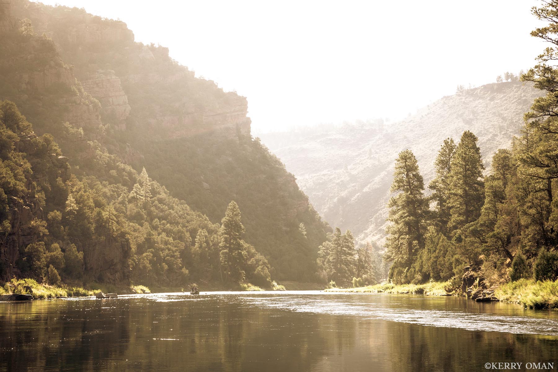 Light in the Canyon The Green River flows in quiet rhythm beneath the towering walls of Red Canyon, just below Flaming Gorge. Morning light filters...