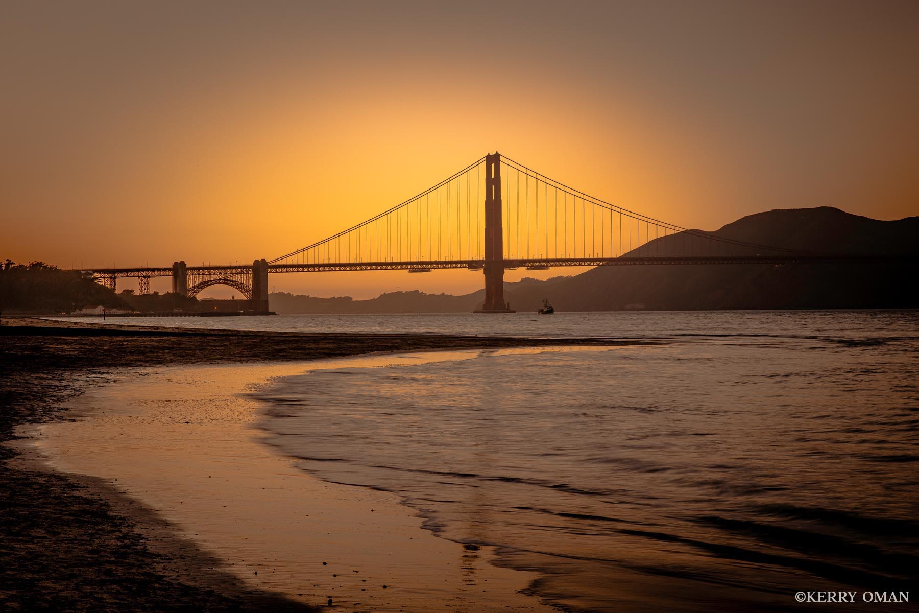 End of Light As the sun dips below the horizon, the Golden Gate Bridge is backlit by a glowing sky, its form silhouetted against the last...